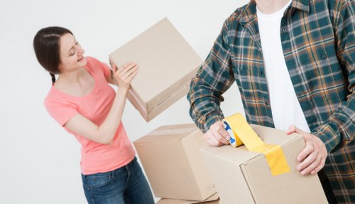Packed boxes and furniture ready for a local move in Wapping