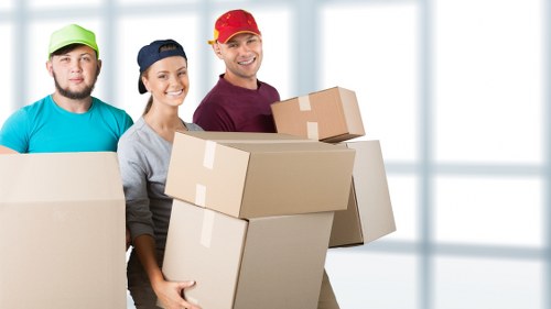 Worker and moving van representing ethical transport operations