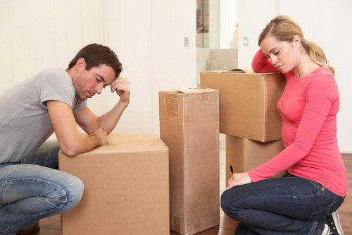 Local movers loading furniture into a van for a Wapping relocation
